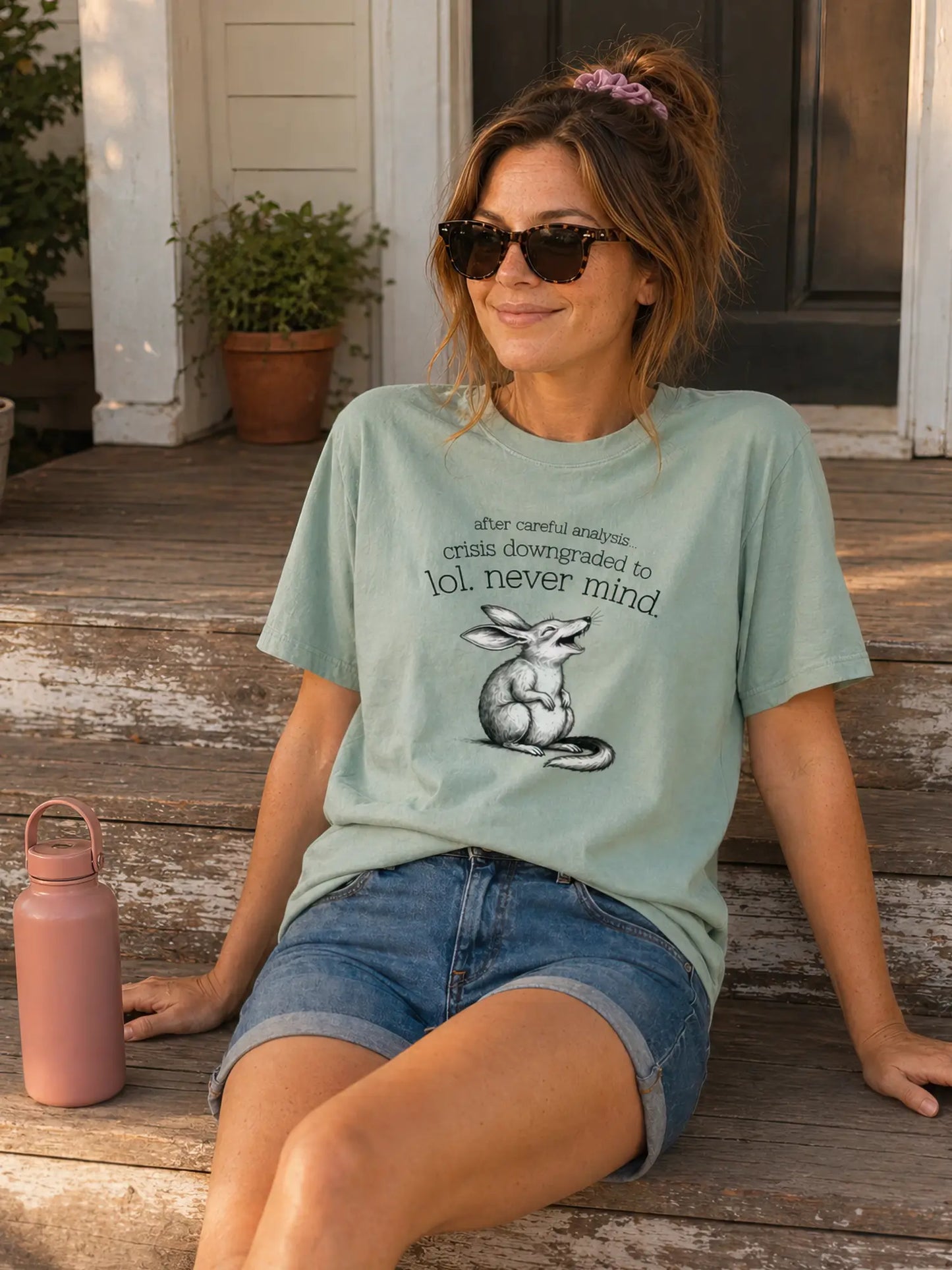 Person wearing the Faffle & Co Bilby Crisis Tee in bay