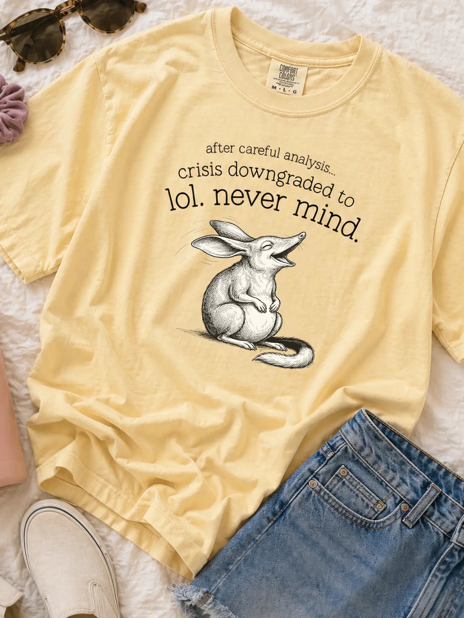 Faffle & Co Bilby Crisis Tee in butter styled flat lay