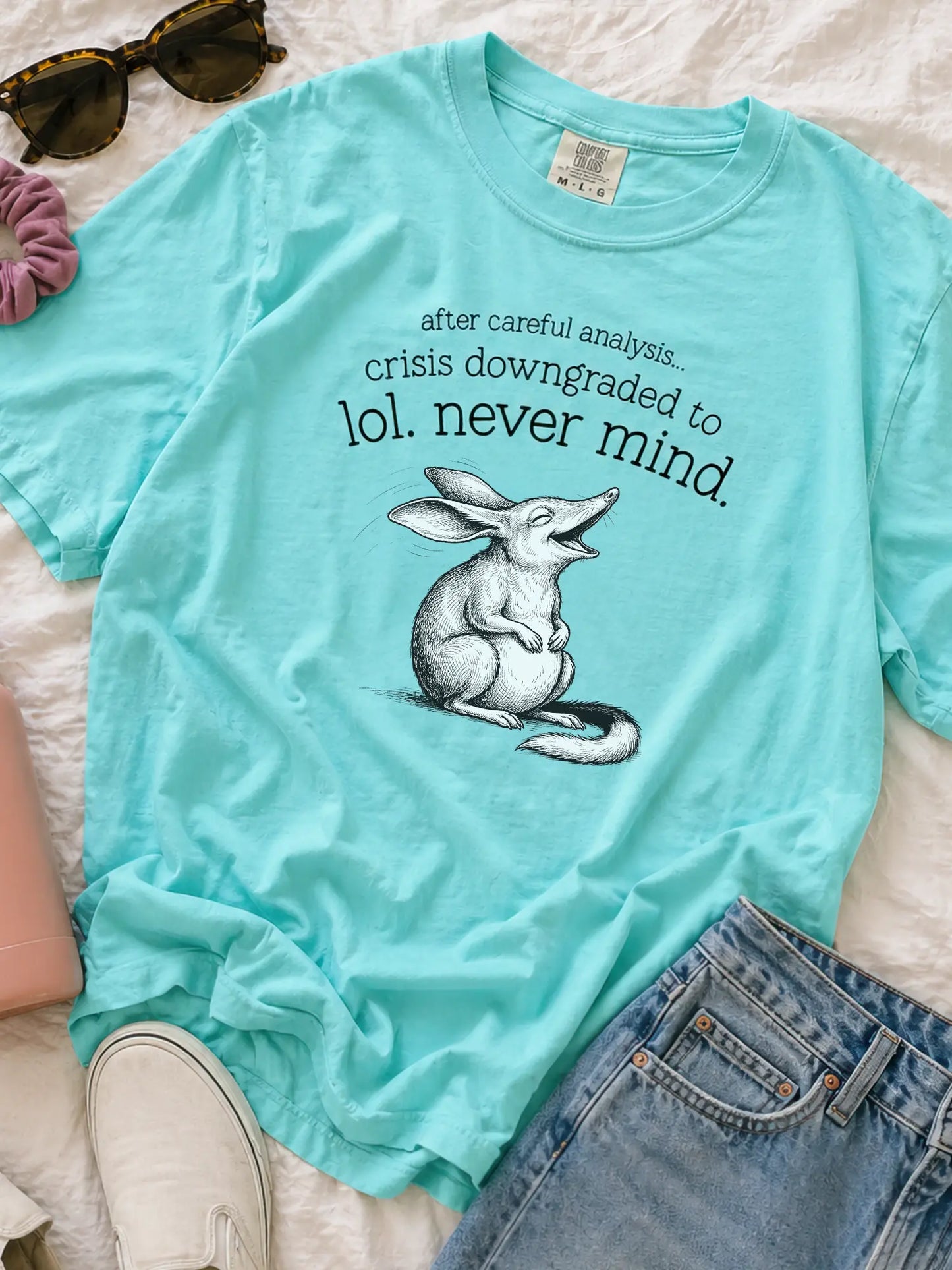 Faffle & Co Bilby Crisis Tee in lagoon blue styled flat lay