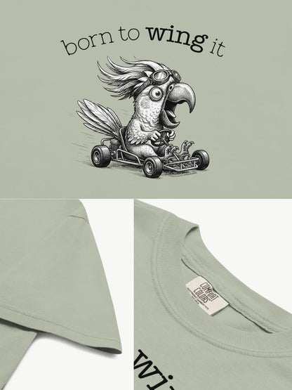 Close-up details of the Born to Wing It cockatoo t-shirt in bay showing print texture, folded view, and collar