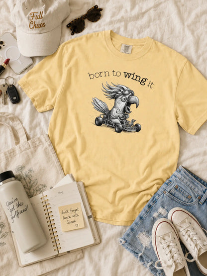 Born to Wing It cockatoo t-shirt in butter styled flat lay