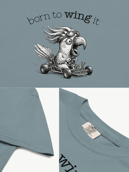 Close-up details of the Born to Wing It cockatoo t-shirt in ice blue showing print texture, folded view, and collar