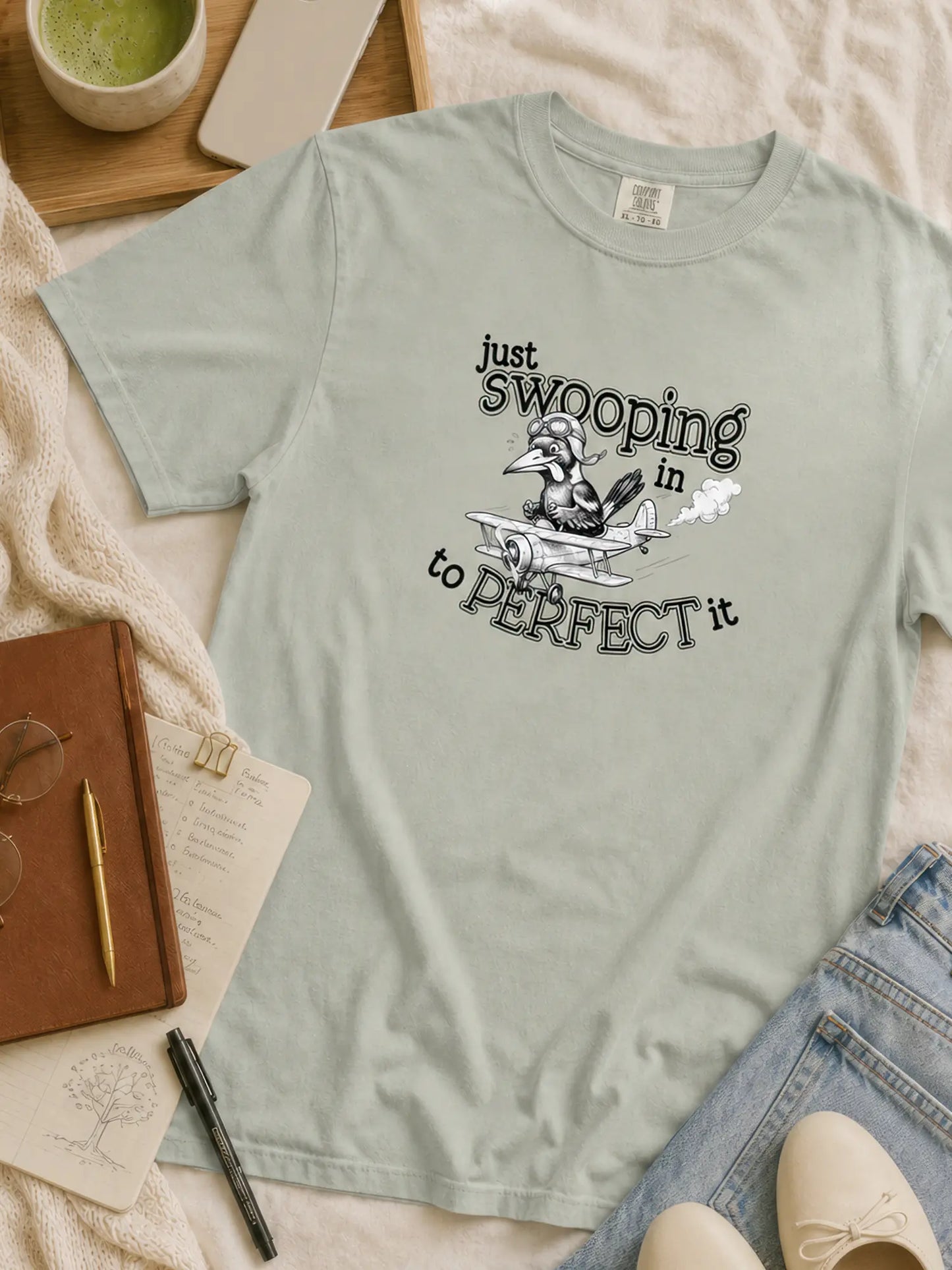 Just Swooping In magpie t-shirt in bay styled flat lay
