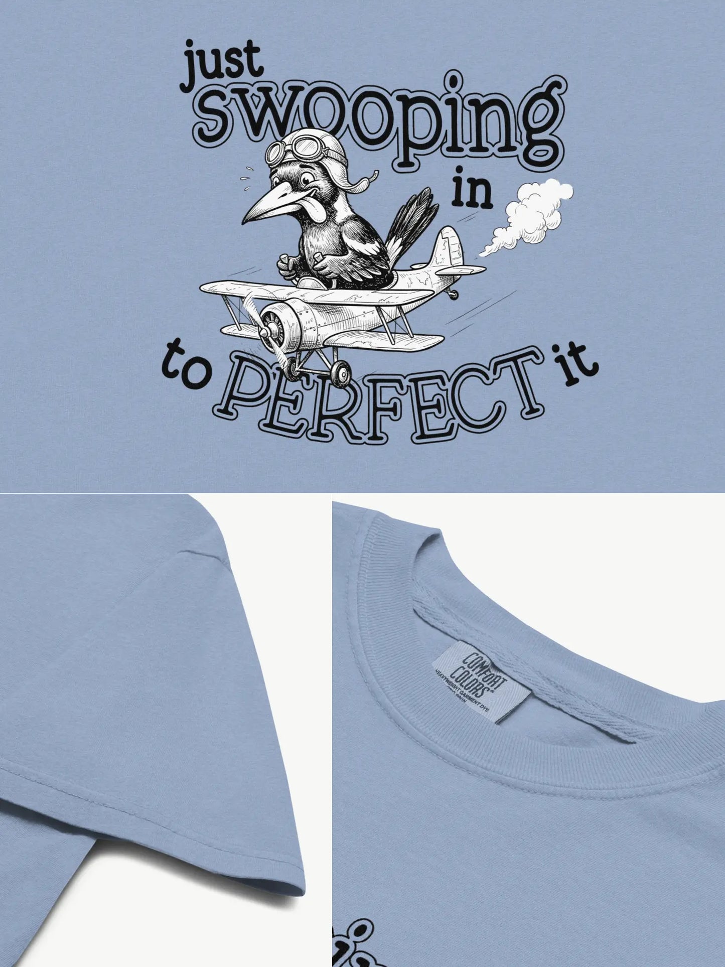 Close-up details of the Just Swooping In magpie t-shirt in washed denim showing print texture, folded view, and collar
