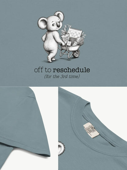 Close-up details of the Off to Reschedule koala t-shirt in ice blue showing print texture, folded view, and collar