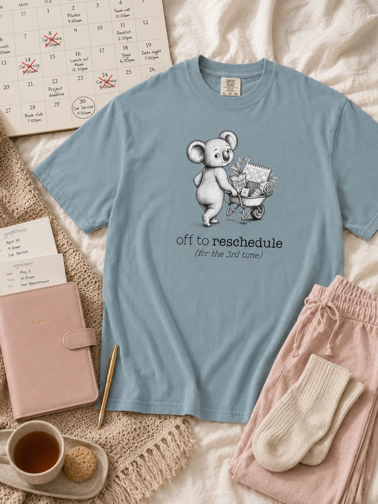 Off to Reschedule koala t-shirt in ice blue styled flat lay