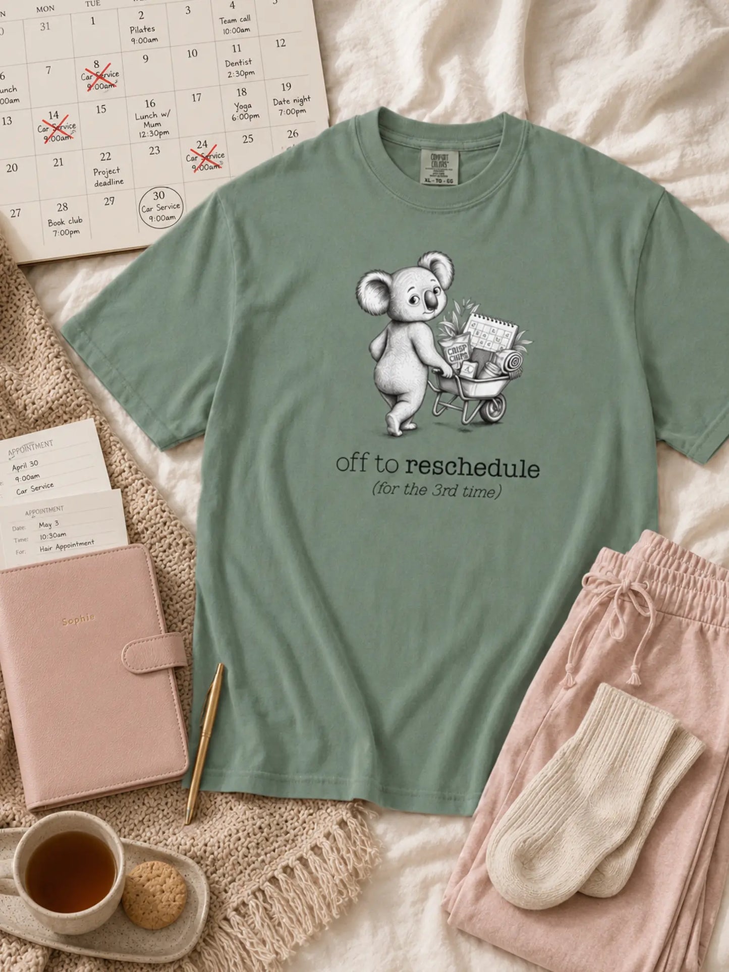Off to Reschedule koala t-shirt in light green styled flat lay