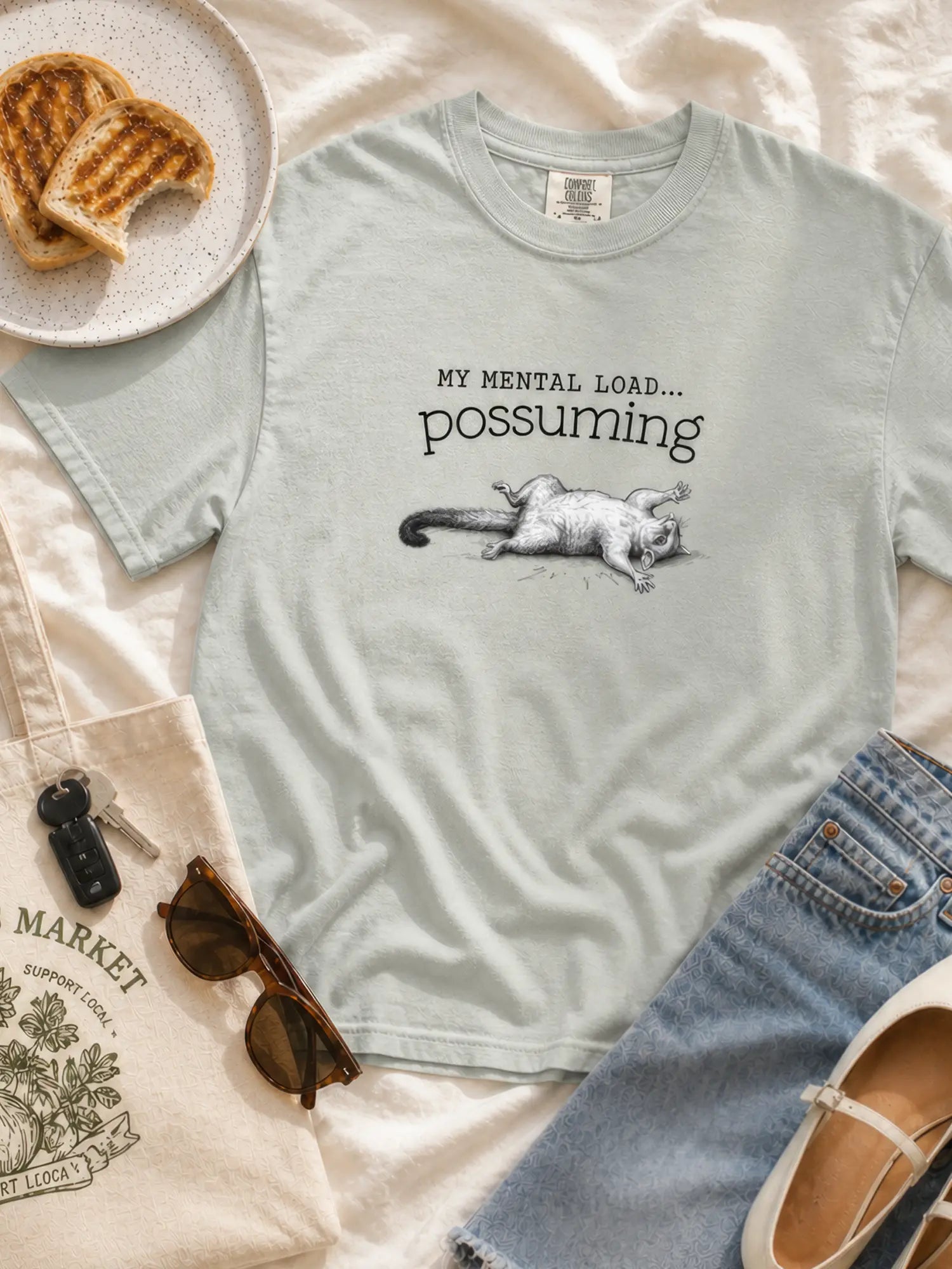 Faffle & Co Possuming Tee in bay styled flat lay
