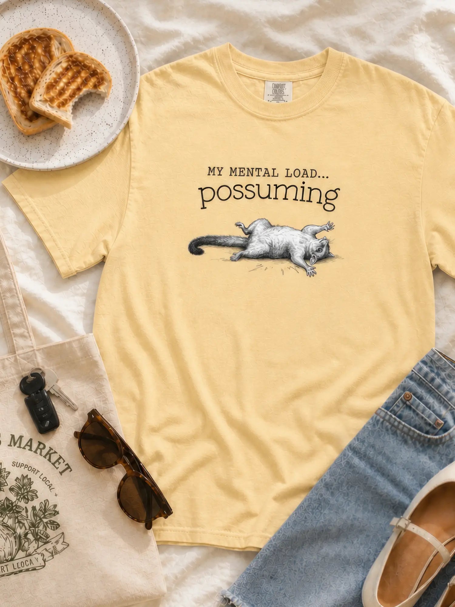 Faffle & Co Possuming Tee in butter styled flat lay
