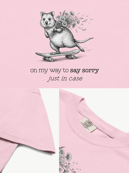 Close-up details of The Sorry Quokka t-shirt in blossom showing print texture, folded view, and collar