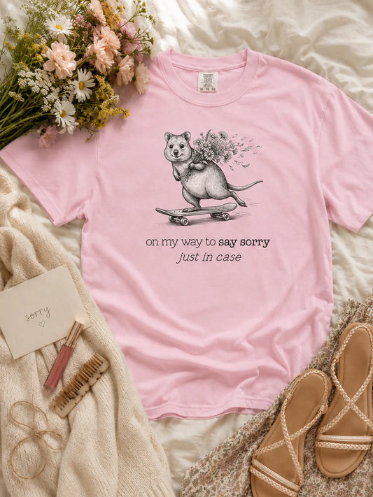 The Sorry Quokka t-shirt in blossom styled flat lay