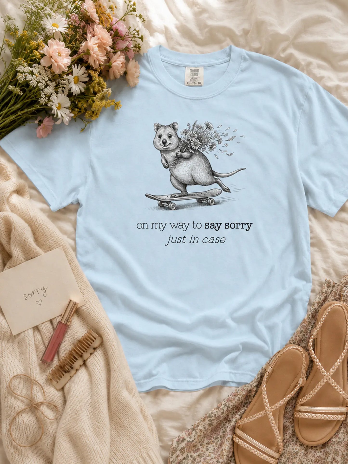 The Sorry Quokka t-shirt in chambray styled flat lay