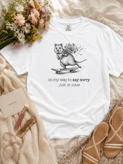 The Sorry Quokka t-shirt in white styled flat lay