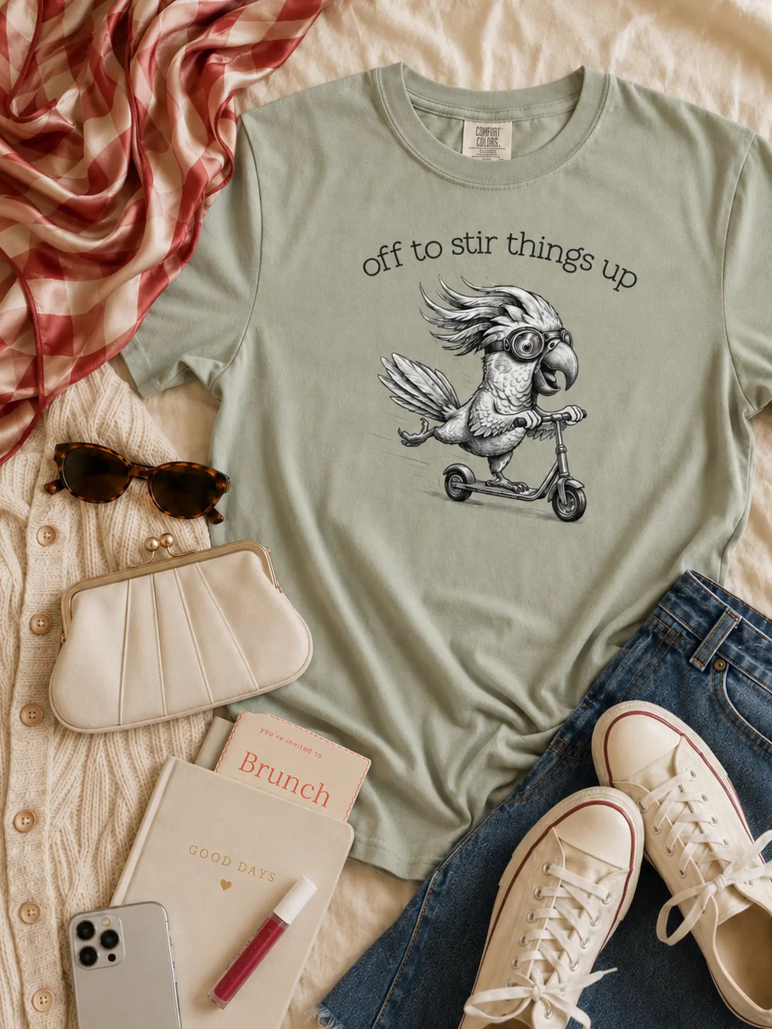Off to Stir Things Up cockatoo t-shirt in bay styled flat lay