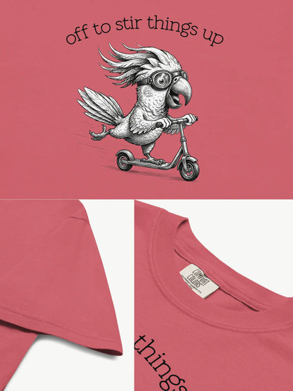 Close-up details of the Off to Stir Things Up cockatoo t-shirt in watermelon showing print texture, folded view, and collar