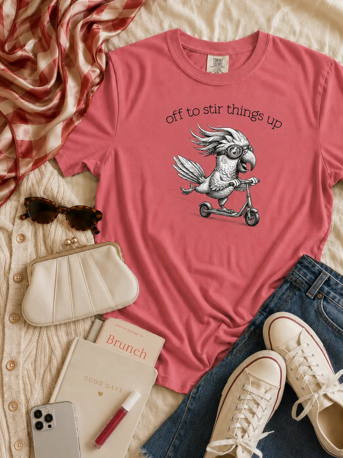 Off to Stir Things Up cockatoo t-shirt in watermelon styled flat lay