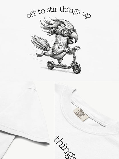 Close-up details of the Off to Stir Things Up cockatoo t-shirt in white showing print texture, folded view, and collar