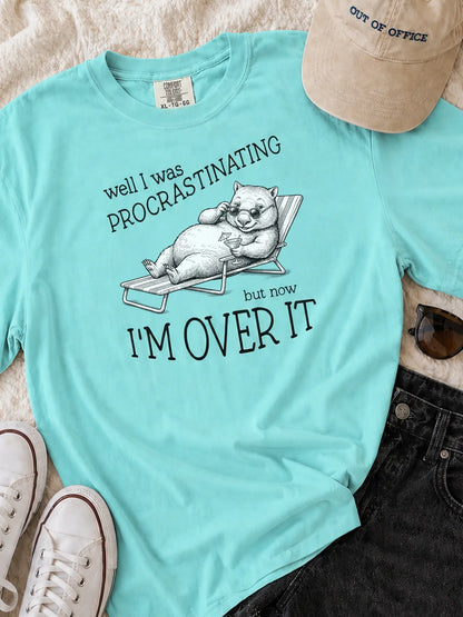 Faffle & Co Wombat Procrastinator Tee in lagoon blue styled flat lay